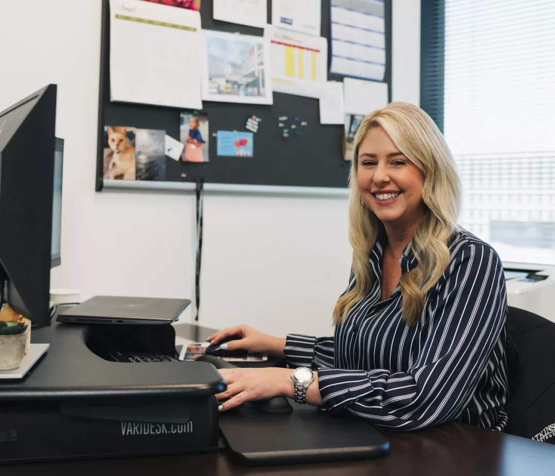 woman smiling at computer  
