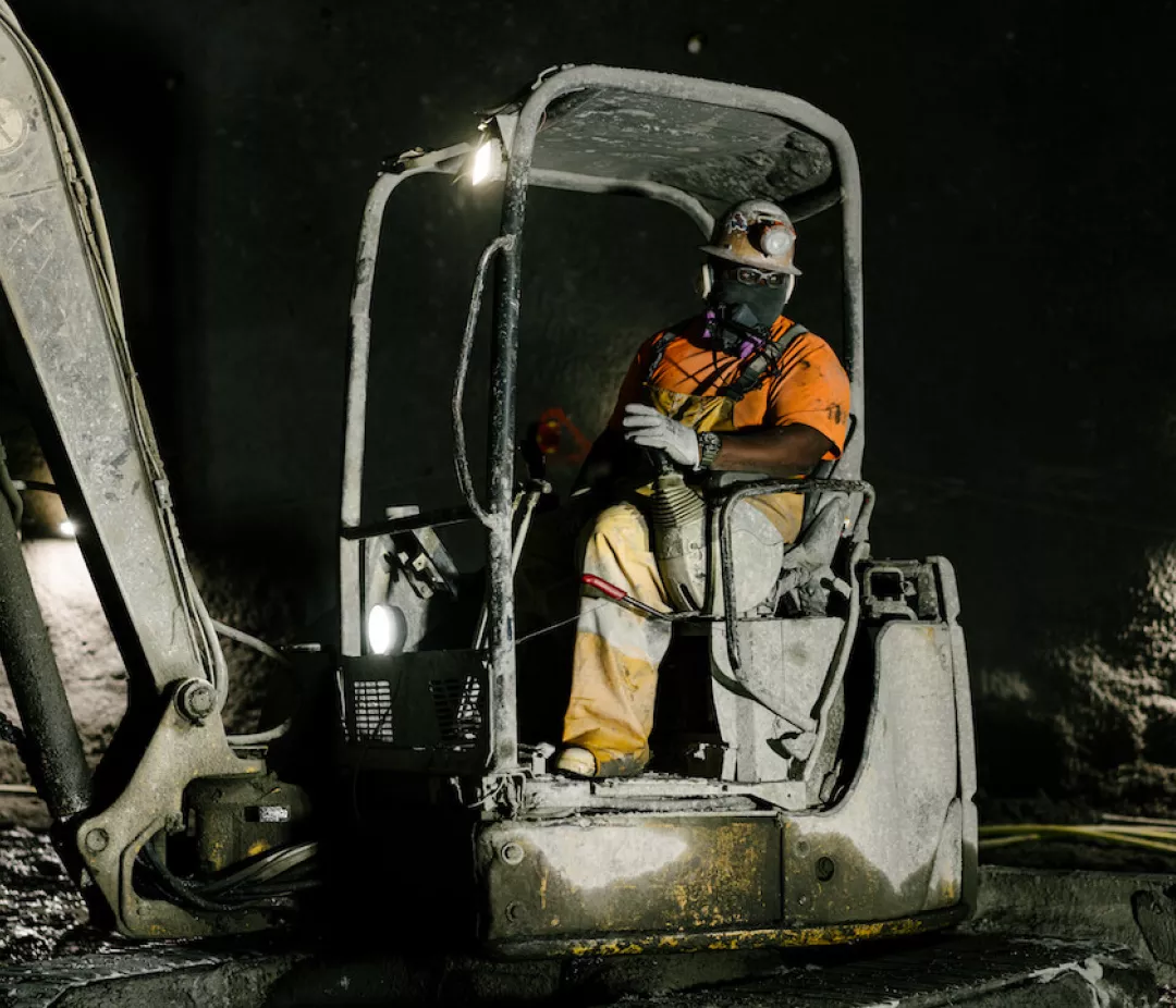 man sitting in crane