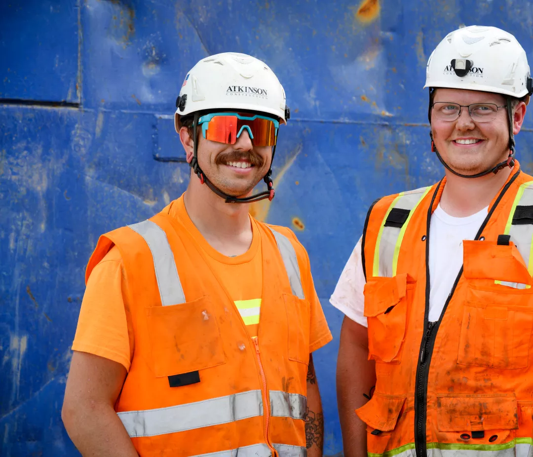 Two Atkinson employees smiling 