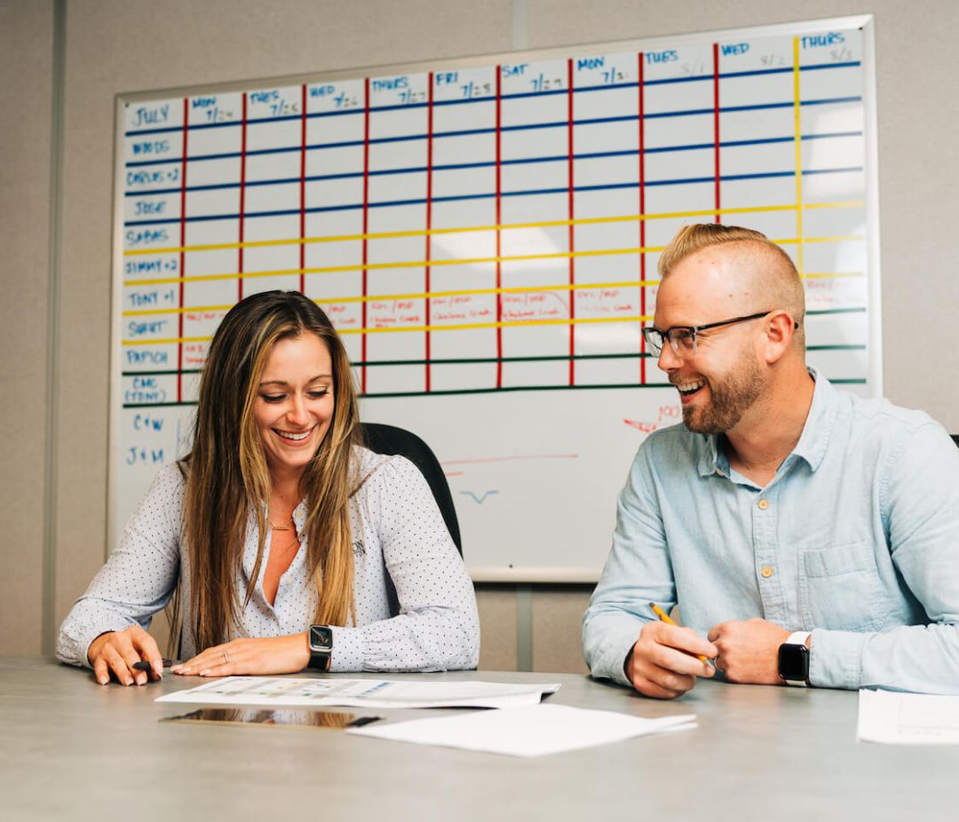 man and woman at desk