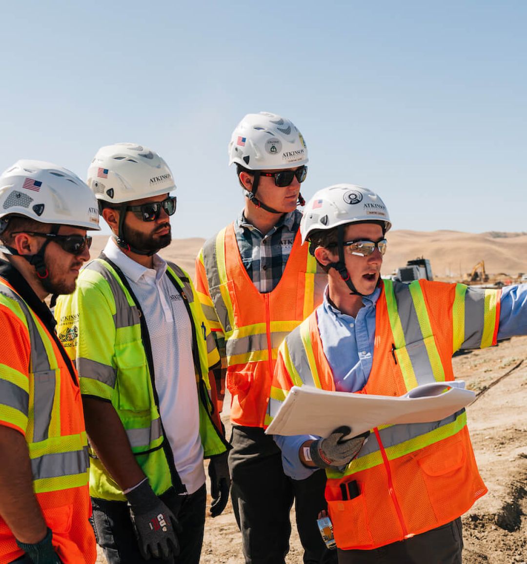 construction team pointing and looking